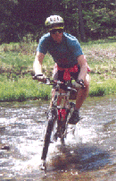 a typical mountain biker trashes creek habitat